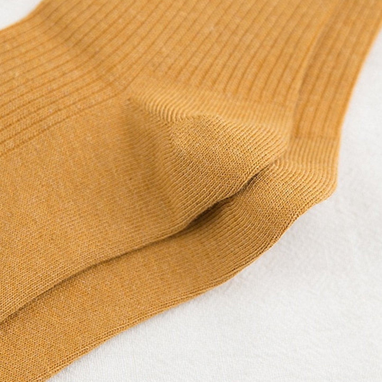 Detailed look at the soft and breathable fabric of the socks, showing their classic and simple design