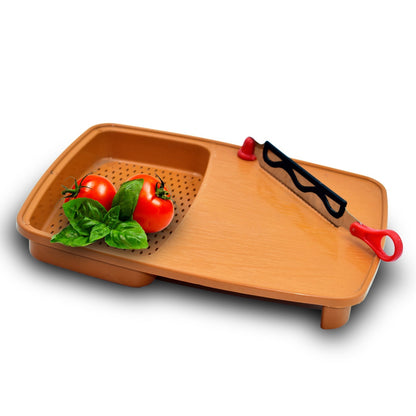 Versatile kitchen chopping tray with built-in holder.