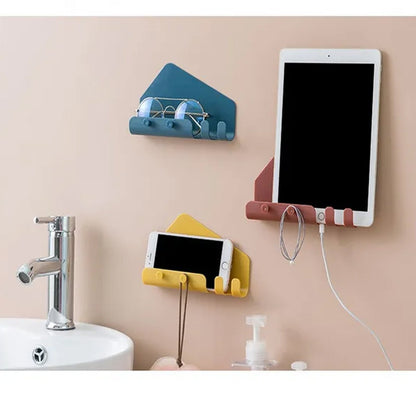 Wall holder for mobile phones and remotes