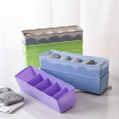 Multi-colored bead storage tray with dividers, ideal for organizing small items.