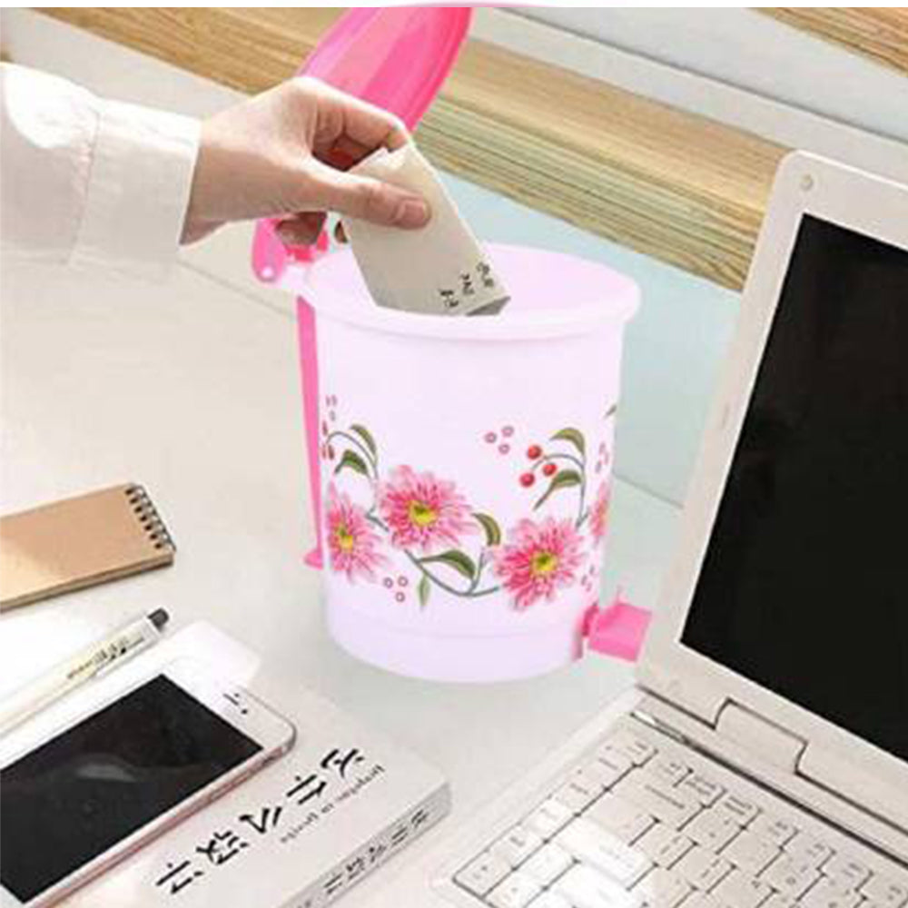 Small plastic pedal dustbin for home or office, easy hands-free use.