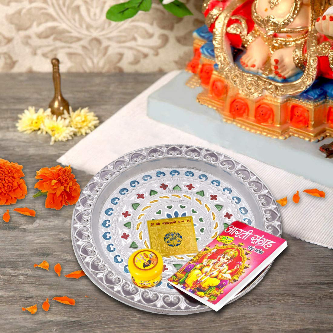 Close-up of silver plated pooja thali.