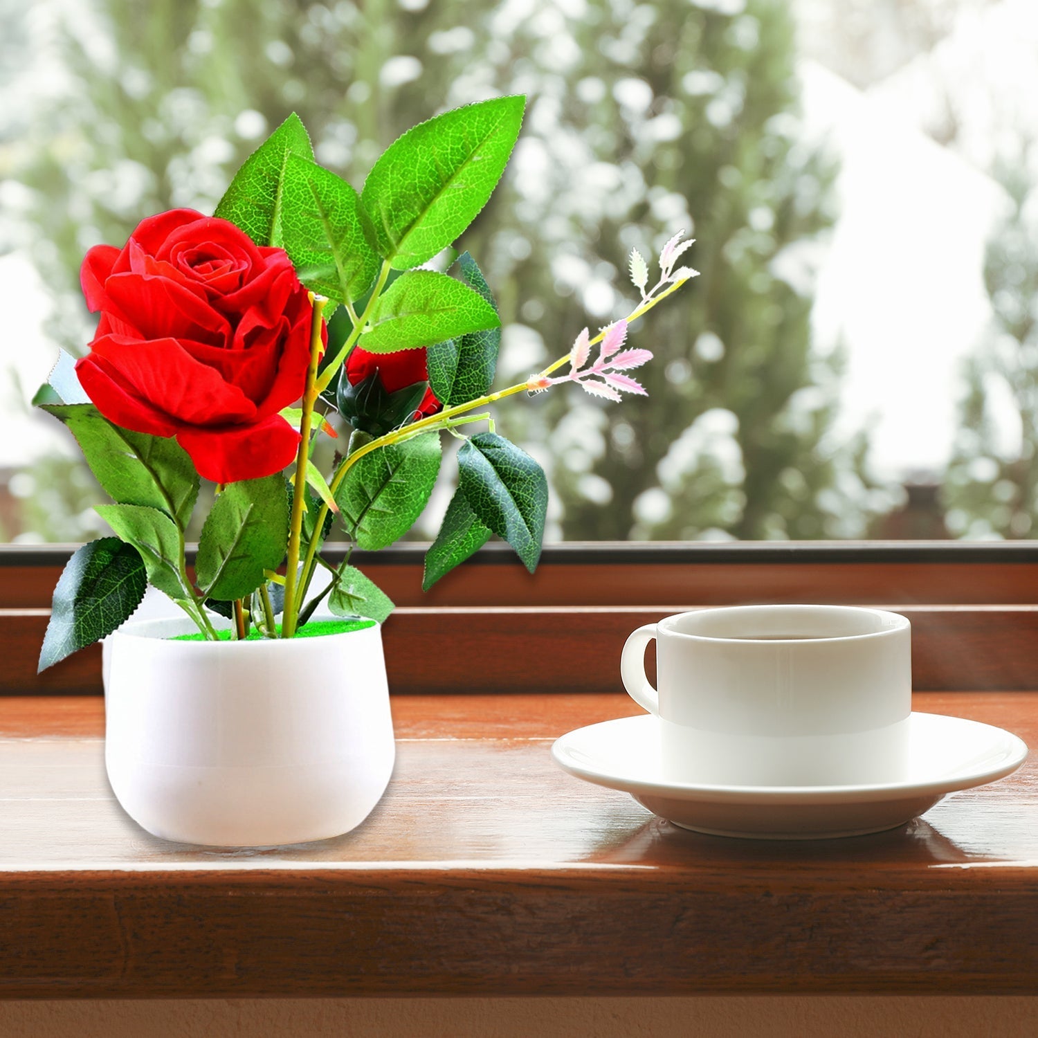 Artificial rose plant in a decorative pot