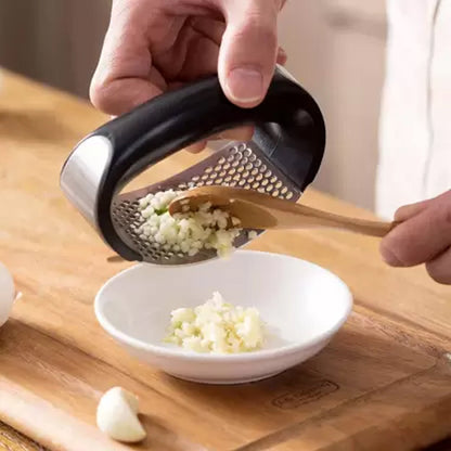 Kitchen garlic press tool